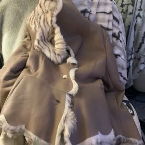 Leather coat with fur striped inside